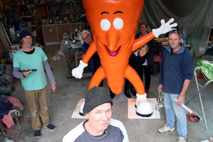 FINAL FIX: Sculptor Mike Walsh puts the finishing touches to the cartoon vegetables that will grace the Ohakune Carrot Adventure Park, with help from Brett McCarten (left) and Fred McKelvey (right). PHOTOS/STUART MUNRO