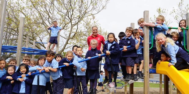 Gemma pictured with the school kids. Photo / Supplied