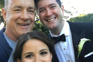 Actor Tom Hanks photobombs couple's wedding photo. Photo / Tom Hank's Instagram