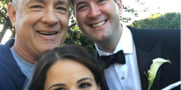 Actor Tom Hanks photobombs couple's wedding photo. Photo / Tom Hank's Instagram