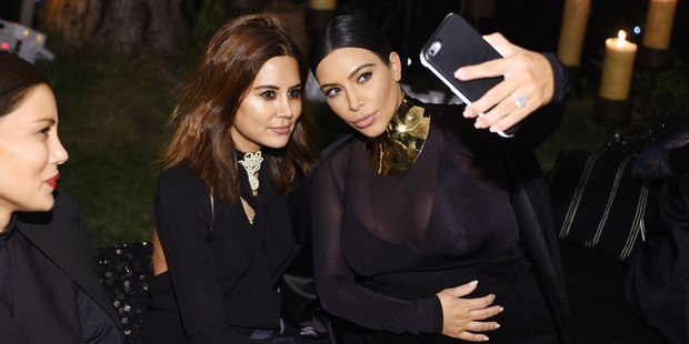 Kim has 84 million followers on Instagram, 48 million on Twitter and is a walking, pouting product placement. Photo / Getty
