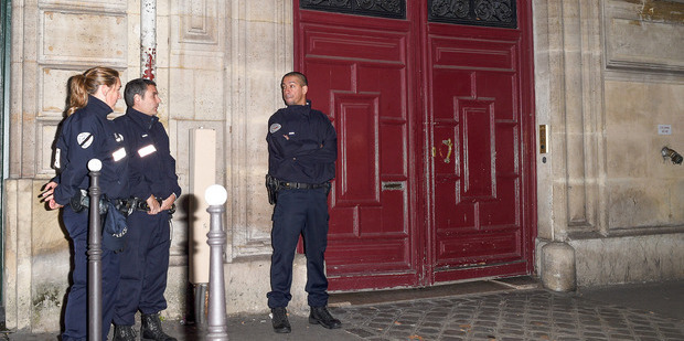 French police officers stand in front of Kim Kardashian's luxury apartment Hotel de Pourtales, where she was robbed at gunpoint. Photo / Getty