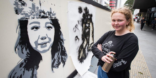 Gabriella Lidstone White, a top Year 13 student at ACG Senior College, has finished spray-painting a mural on the hoardings of the Central City library on Lorne Street. Photo / Jason Oxenham