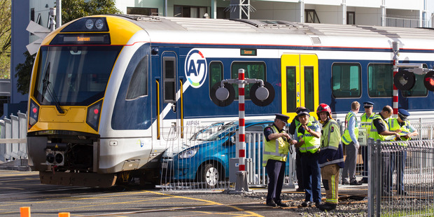 Emergency services at the scene of the level crossing crash at Morningside Drive. Photo / Jason Oxenham.
