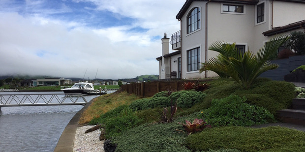 A hat belonging to Luke Cochrane was found close to the water's edge somewhere along this stretch of the waterway, residents say. Photo / Belinda Feek