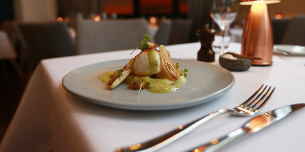 Caught market fish cloudy clams roasted fennel and garlic shoots. Photo / Doug Sherring