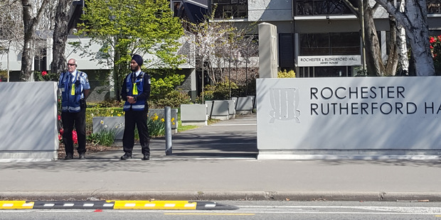 Security outside the Rochester and Rutherford Halls of Residence following the sudden death of a student. Photo / Newstalk ZB