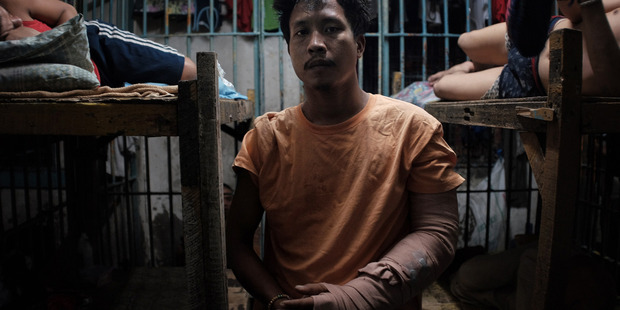Francisco Santiago jnr, 21, is recuperating while inside a jail cell. The police said that Santiago was selling drugs and was shot during a sting operation. Photo / Washington Post