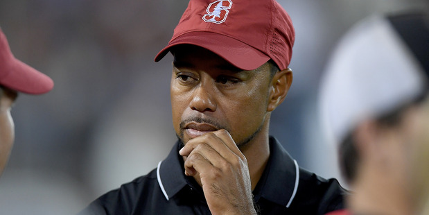 Tiger Woods looks on from the sidelines during an NCAA football game. Photo / Getty Images