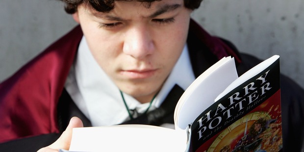 A Harry Potter fan begins to read the novel by author J.K. Rowling. Photo / Getty