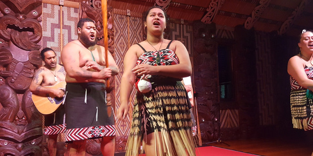 A cultural performance in the meeting house at Waitangi. Photo / Winston Aldworth