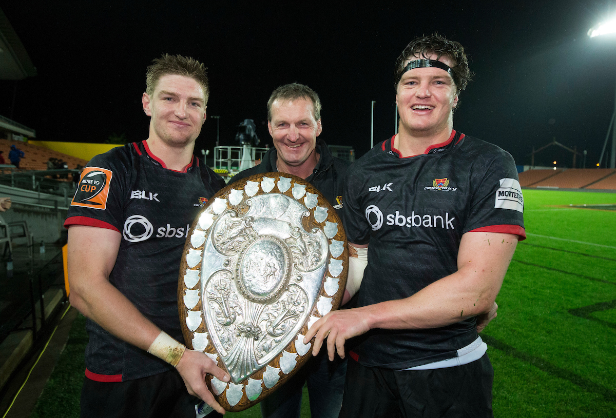 Jordie Barrett (L) with father Kevin and brother Scott Barrett holding the Ranfurly shield. Photo / Photosport