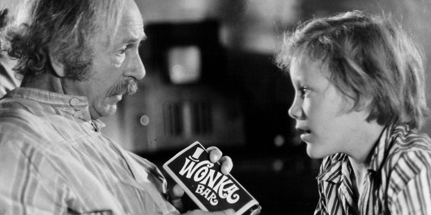 Jack Albertson showing Peter Ostrum a Wonka bar in a scene from the film 'Willie Wonka And The Chocolate Factory', 1971. Photo / Getty