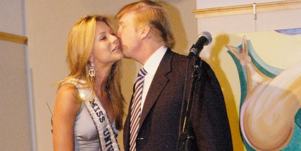 Donald Trump kisses Miss Universe, Jennifer Hawkins at a cocktail party hosted by the Hon. Ken Allen, Consul General of Australia, in celebration of her crowning. Photo / Getty