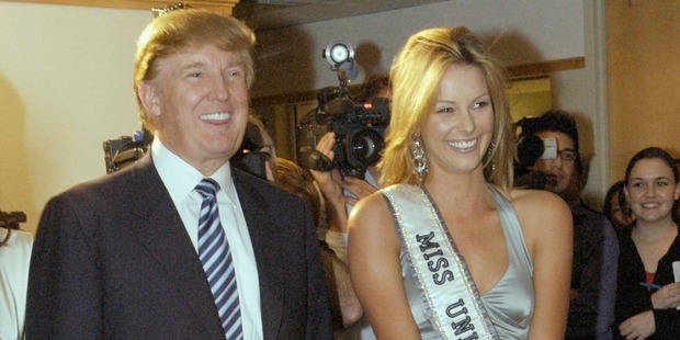 Miss Universe, Jennifer Hawkins and Donald Trump pose for photographers at a cocktail party hosted by the Hon. Ken Allen, Consul General of Australia. Photo / Getty