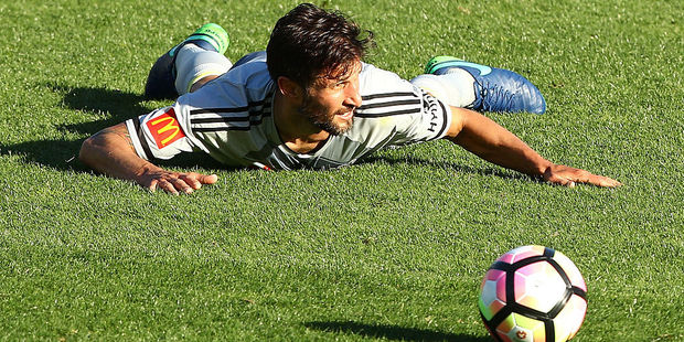 Phoenix midfielder Vince Lia attempts an innovtative new football strategy against Perth. Photo / Getty