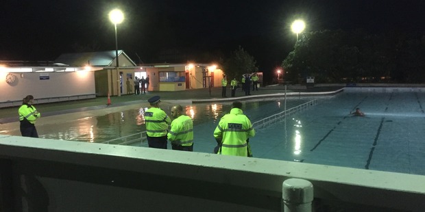 The man refused to leave the pool, standing in the middle and pulling martial arts poses instead. Photo/ Jeremy Batten