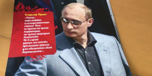 Putin shows off a mafia-like look. Photo / via Twitter