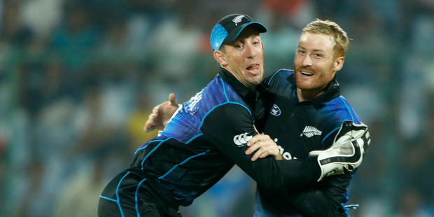 New Zealand's Luke Ronchi and Martin Guptill celebrate during this morning's thrilling six-run win over India. Photo / AP.