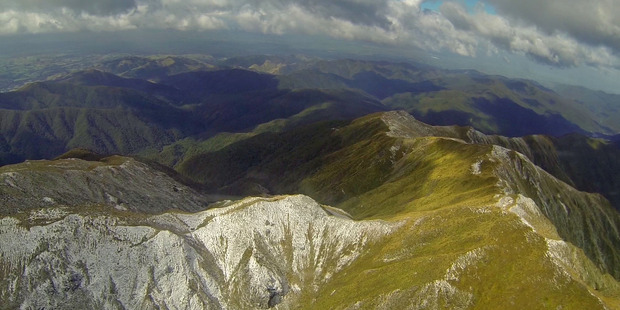 A mother and her two boys, aged 10 and 12, have been rescued after a cold, wet night in the Tararua Range. Photo / File