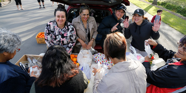 Selina Harris, Reriana Rewha-Gardener, Shirley-Anne Paul and Hadassah Mahanga put together lunch packs for families in need. Photo / John Stone