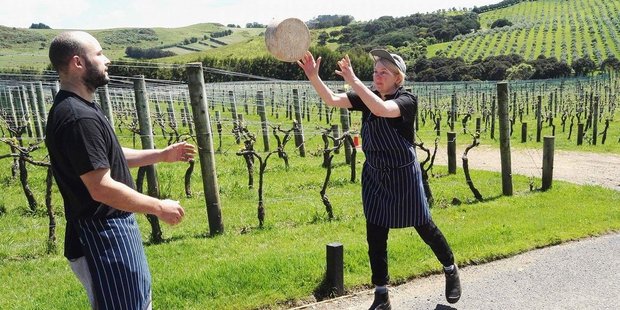 Chef Bronwen Laight, from Te Motu Vineyard, throws a wheel of Cwmglyn in solidarity with artisan cheesemakers. PHOTO/TWITTER
