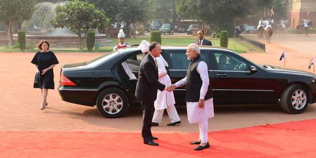 John Key shakes hands with Narendra Modi while Bronagh Key walks to join them. Photo / Supplied