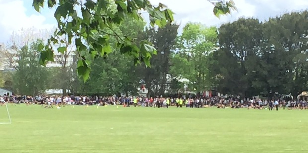 Children from Hamilton's Hillcrest High School are gathered on the school field. Photo / Belinda Feek