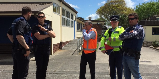Police on the scene at Hillcrest High School in Hamilton.