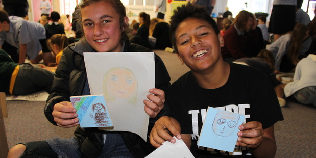 SPECIAL MOMENT: Taliyah Farrell, 13, and Markyrious Farrell, 11, took part in an art project which features a relative of theirs.