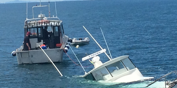 Boat sinking and recovery in the Hauraki Gulf. Photo / Kim Francis