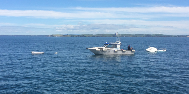 Boat sinking and recovery near Rakino Island. Photo / Kim Francis