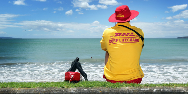 A surf lifesaver at Red Beach, Auckland. Photo / Doug Sherring