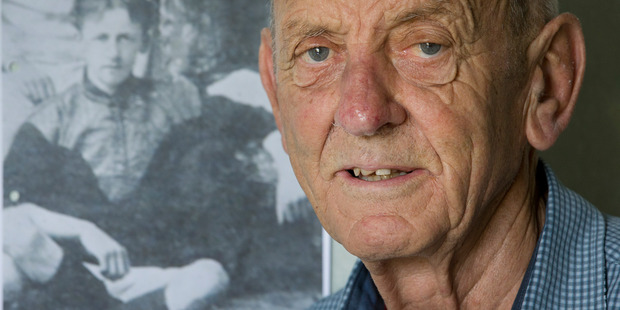 David Braithwaite pictured in front of a photograph dating back to 1903 of his uncle, Private Jack Braithwaite, who was executed by the British Army on a charge of mutiny in October 1916.