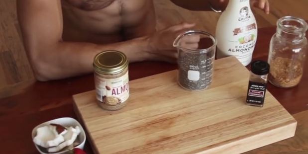 Franco talks through his key ingredients, sans shirt. Photo / YouTube, Franco Cooks