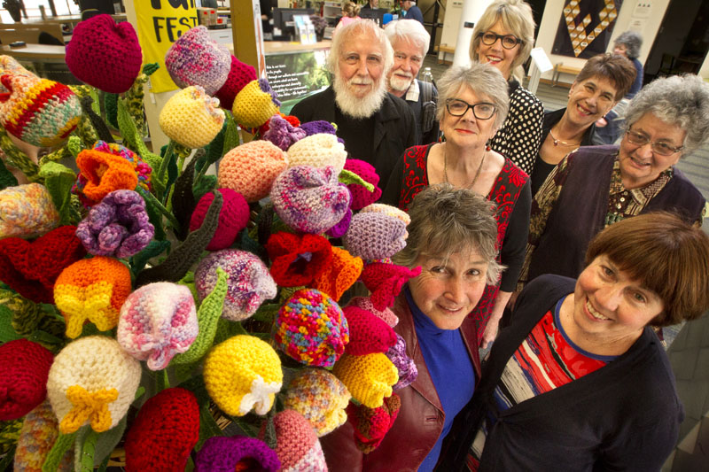 Members of the U3A Rotorua present councillors Karen Hunt and Merepeka Raukawa-Tait with tulips made by the knitting and crochet group. 