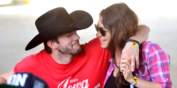Actors Ashton Kutcher (L) and Mila Kunis attend day 1 of 2014 Stagecoach: California's Country Music Festival at the Empire Polo Club on April 25, 2014. Photo / Getty