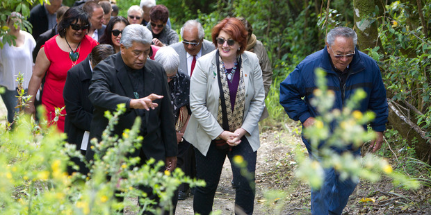 Conservation Minister Maggie Barry, centre, walks to the site of the proposed marae at Lake Tarawera. Photo/Ben Fraser