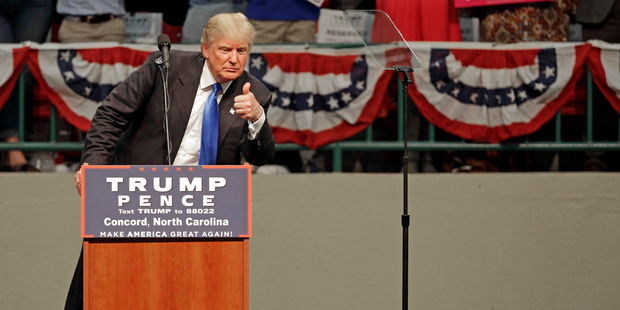 Donald Trump gestures as he speaks during a campaign rally. Photo / AP