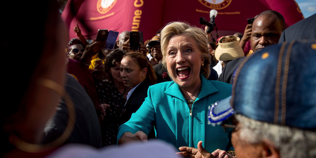 Hillary Clinton greets people at a homecoming tailgate party for Bethune-Cookman University Wildcats. Photo / AP