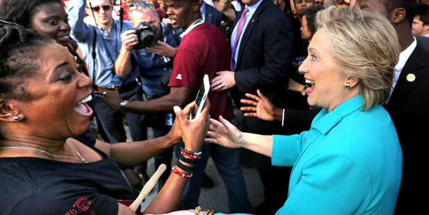 Hillary Clinton greets supporters as she makes her way through the crowd in Daytona Beach, Florida. Photo / AP
