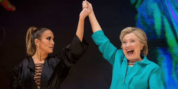 Hillary Clinton takes the stage with performer Jennifer Lopez at a Get Out The Vote performance in Miami. Photo / AP