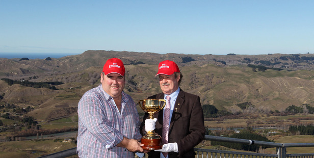 UP FOR GRABS: Hawke's Bay Racing CEO Andrew Castles (left) with one of the Melbourne Cup callers Bryan Martin pictured with the Cup on Te Mata Peak earlier in the year.