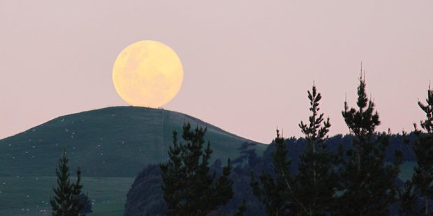 A "supermoon" looms large above Mt Rangitumau near Masterton in 2014. Photo / File