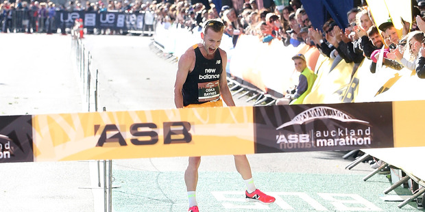 Oska Inkster-Baynes crossed the finish line to win the ASB Auckland Marathon. Photo / Getty Images