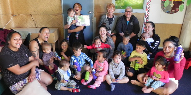 Papamoa's Te Kohanga Reo o Te Akau with BOPDHB Oral Health Promoter Norma Van Arendonk (seated back middle) and Te Kupenga Hauora's Paretapu Clarke (seated back right). PHOTO/SUPPLIED