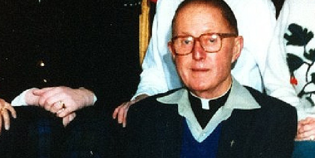Priest Peter Searson in a school staff photograph at Holy Family Primary School. Photo / Supplied