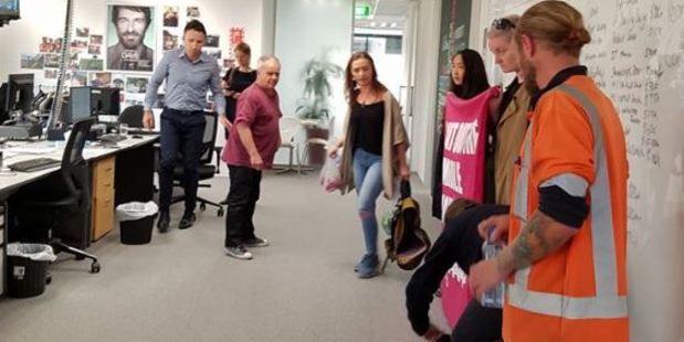A photo of the protest posted by former Greens MP Sue Bradford, who is one of the protesters inside the offices. Photo / Facebook