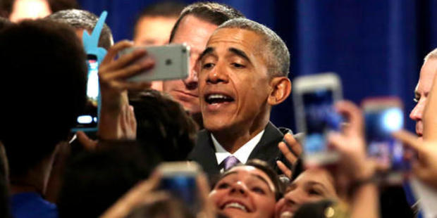 President Barack Obama poses for photographs with the crowd after speaking about the Affordable Care Act (ACA), which Trump has vowed to appeal. Photo / AP