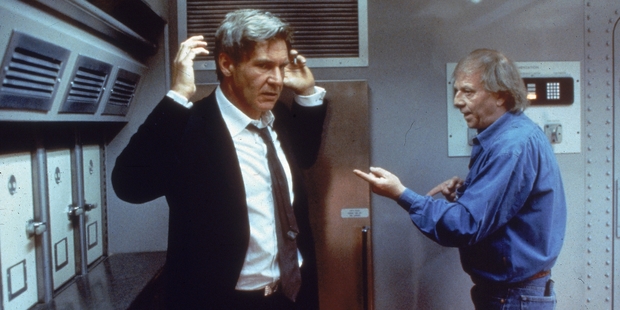 1997: German-born director Wolfgang Petersen (right) instructs American actor Harrison Ford on the set of Peterson's film, 'Air Force One.' Photo / Getty